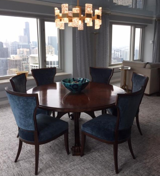expert interior design round table in front of condo window overlooking Chicago